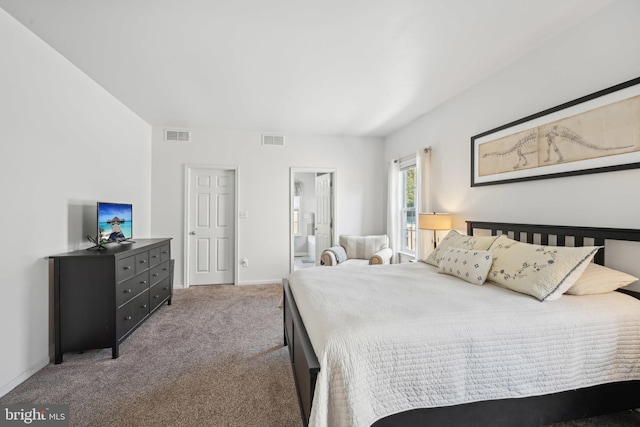 carpeted bedroom with ensuite bathroom