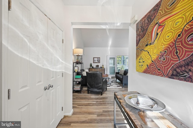 hallway with light hardwood / wood-style flooring