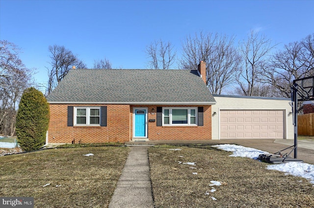 view of front of property with a garage and a front yard