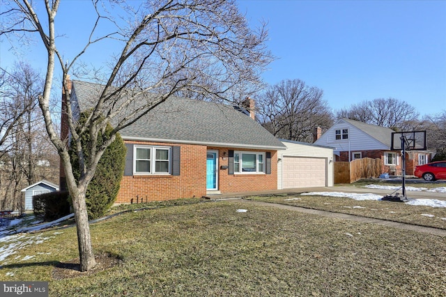 view of front facade featuring a garage and a front lawn