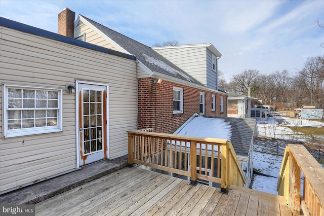 view of snow covered deck