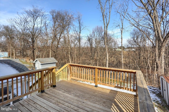 wooden terrace with a shed