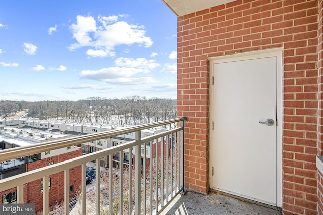 view of snow covered back of property