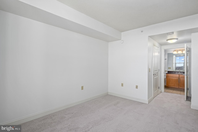 carpeted empty room with sink