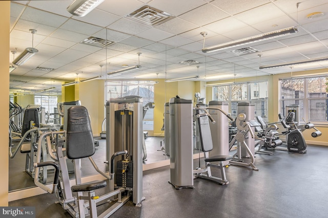 workout area featuring a drop ceiling