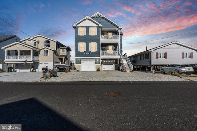 view of front of property featuring a balcony