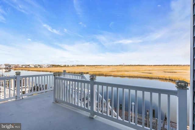 balcony featuring a water view