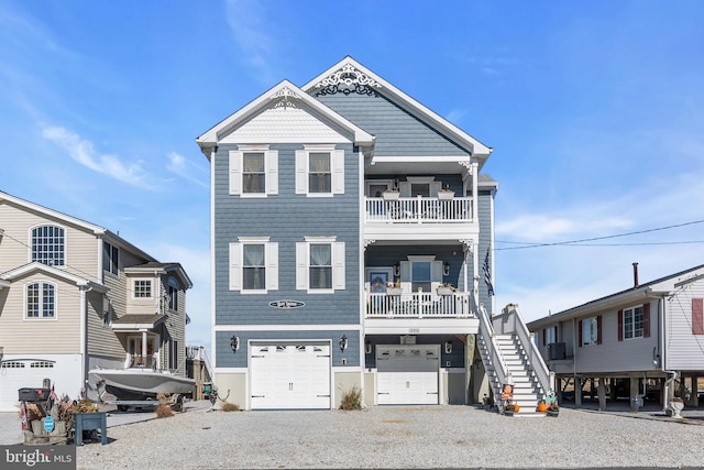 view of front of property featuring a garage and a balcony