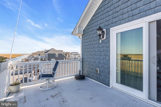 view of patio featuring a balcony