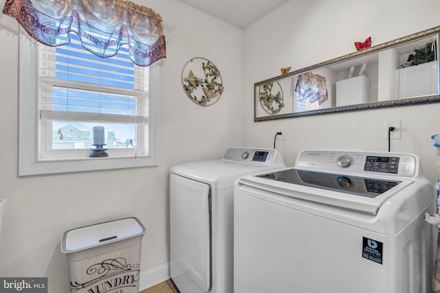 laundry area with washing machine and clothes dryer