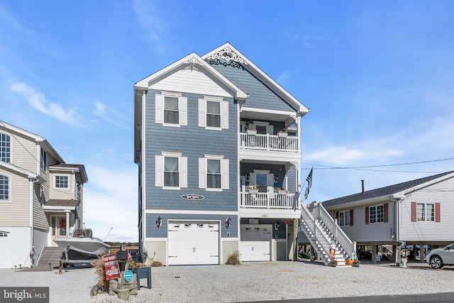 view of front of property with a garage and a balcony