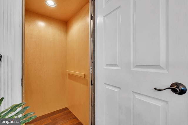 room details with elevator and wood-type flooring