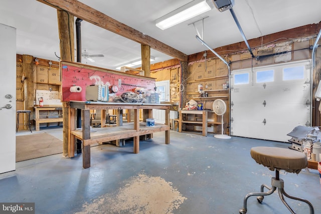 garage featuring a garage door opener and a workshop area