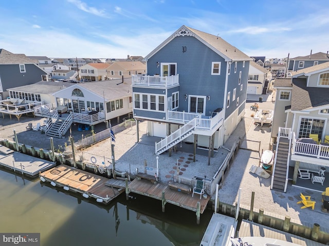 back of property with a water view