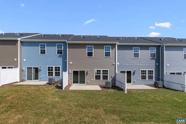 rear view of property featuring cooling unit and a patio area