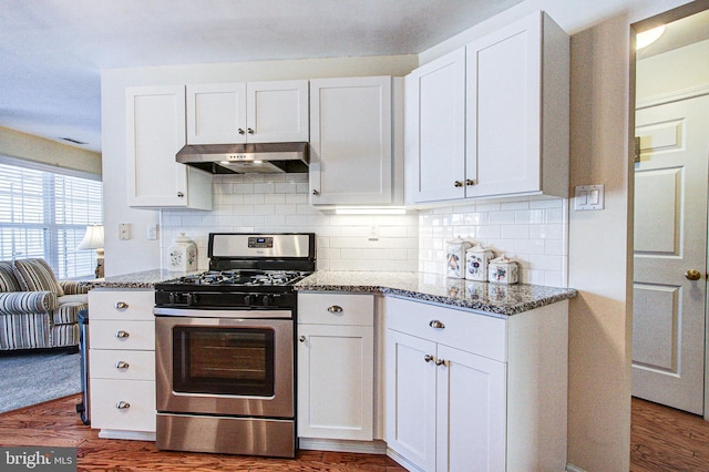 kitchen with stainless steel range with gas stovetop and white cabinets