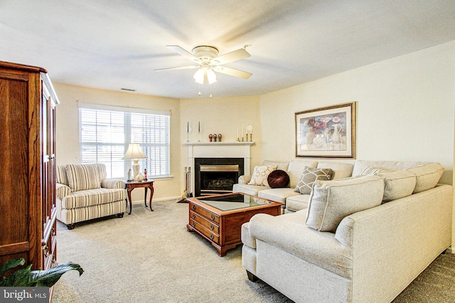 carpeted living room featuring ceiling fan