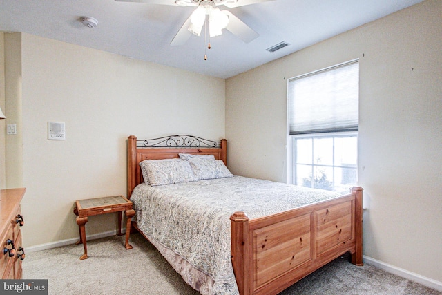 bedroom with light carpet and ceiling fan