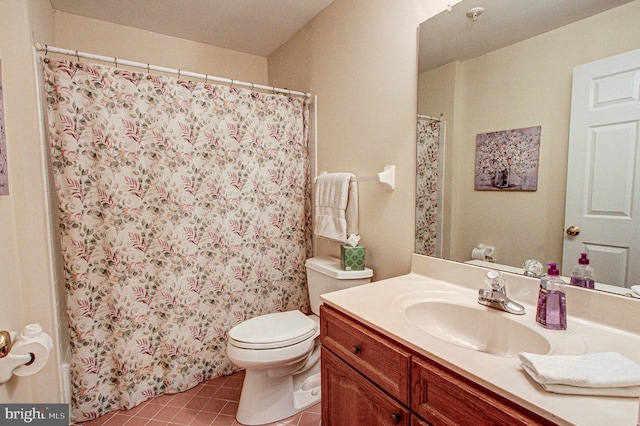 bathroom featuring a shower with shower curtain, vanity, toilet, and tile patterned flooring