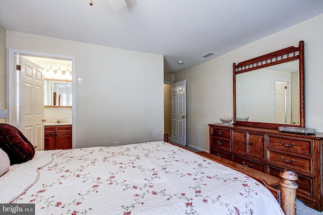 bedroom with sink and ensuite bathroom