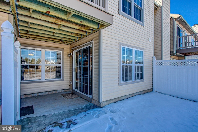 view of exterior entry featuring a patio