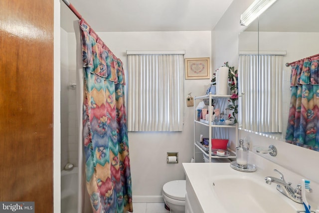 bathroom with tile patterned flooring, toilet, vanity, and a shower with curtain