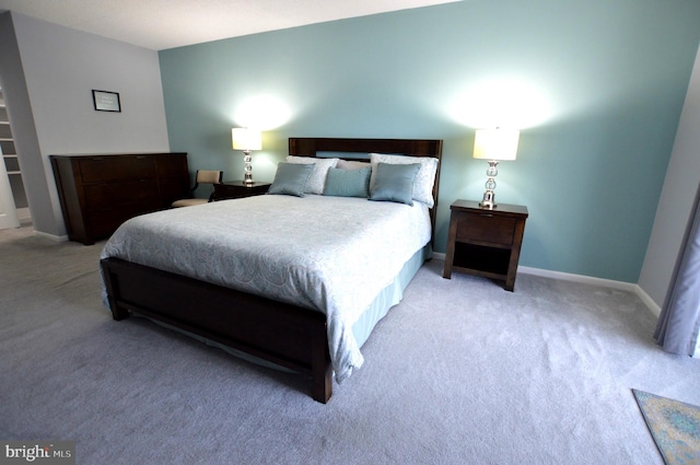 bedroom featuring light carpet