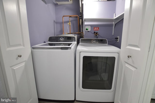 laundry room with independent washer and dryer