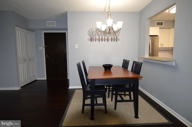 dining space featuring dark hardwood / wood-style floors