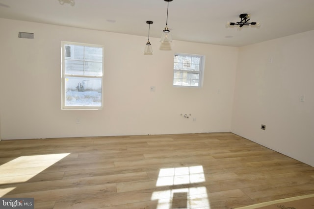 empty room with light hardwood / wood-style floors