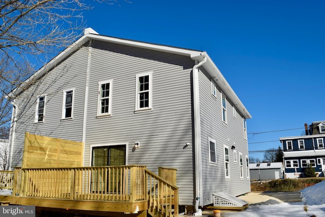 back of house featuring a deck