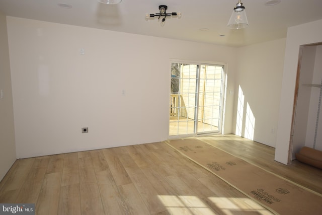 unfurnished room featuring light hardwood / wood-style floors