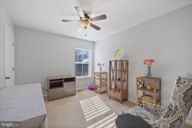 bedroom featuring light carpet and ceiling fan