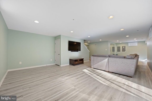 unfurnished living room with light wood-type flooring