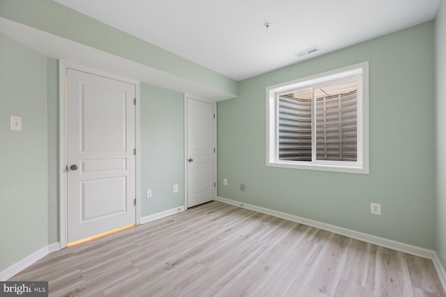 unfurnished bedroom with light hardwood / wood-style flooring