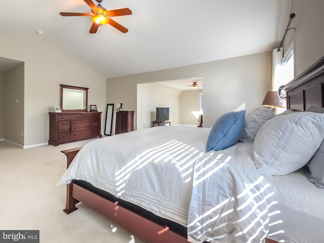 bedroom with lofted ceiling, light carpet, and ceiling fan