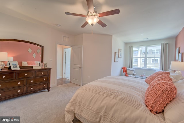 bedroom with light colored carpet and ceiling fan