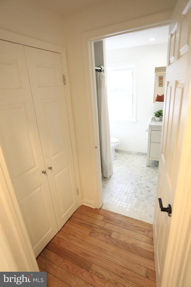 corridor featuring light hardwood / wood-style flooring