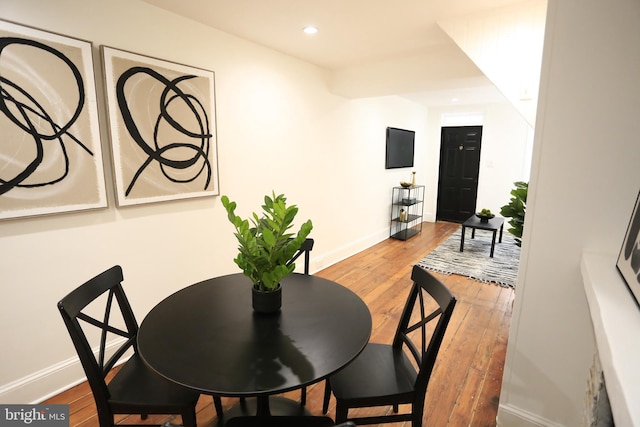 dining room with hardwood / wood-style flooring