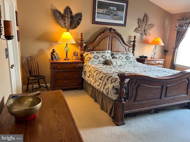 bedroom featuring light colored carpet