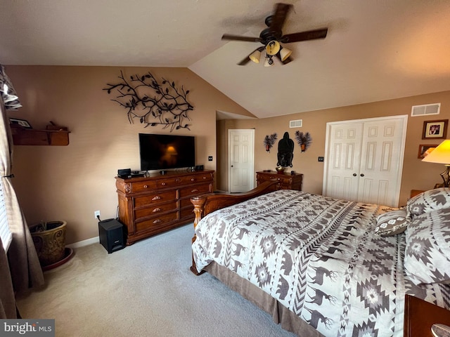 carpeted bedroom featuring vaulted ceiling, ceiling fan, a closet, and visible vents