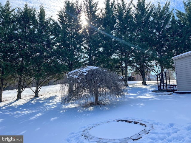 view of yard layered in snow