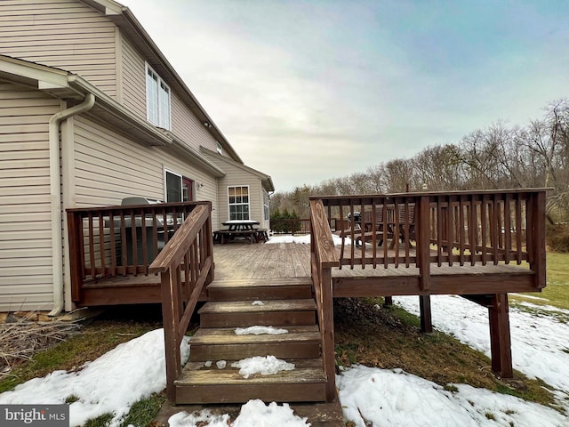 view of snow covered deck