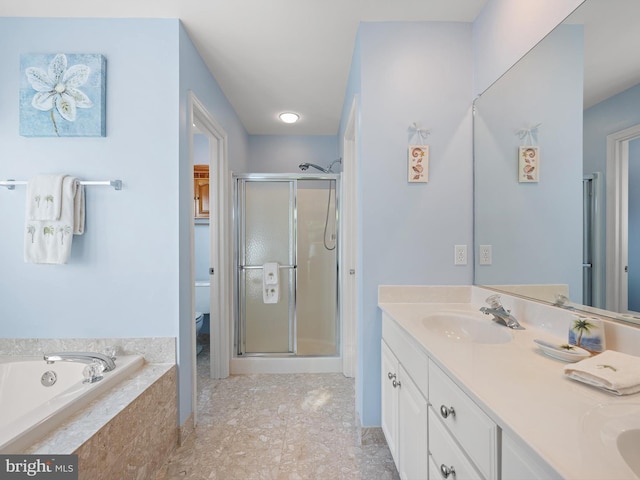 full bathroom featuring independent shower and bath, vanity, and toilet