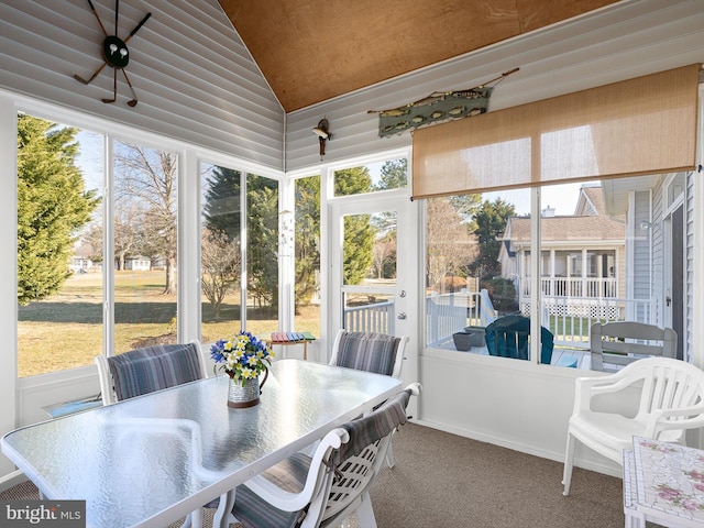 sunroom with lofted ceiling