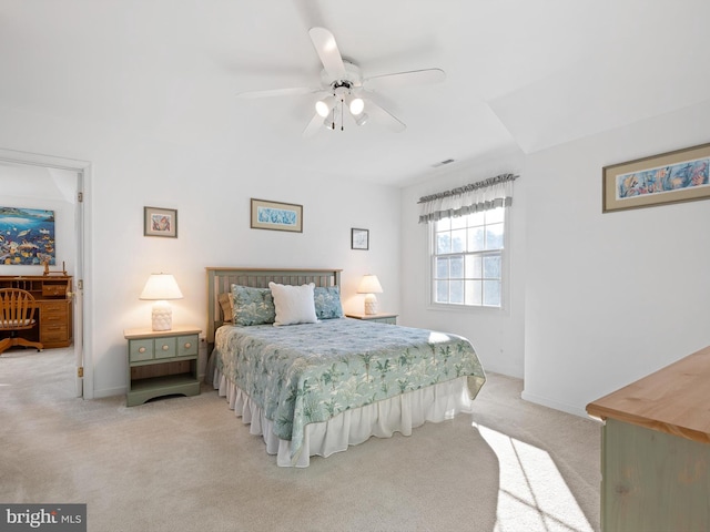 bedroom with light carpet and ceiling fan