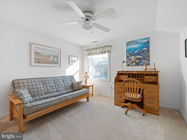 office area featuring ceiling fan, vaulted ceiling, and light carpet