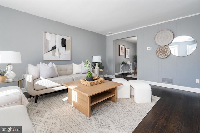 living room with wood-type flooring and wood walls