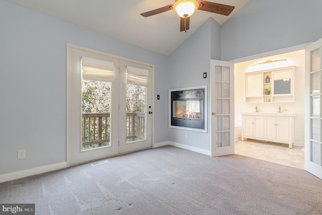 unfurnished living room with light carpet, visible vents, and baseboards