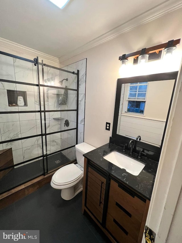 bathroom with ornamental molding, toilet, a shower with shower door, and vanity